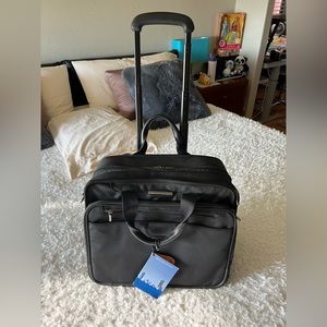 Briggs&Riley, new, never had a chance to use